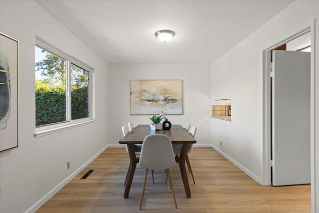 dining room with light hardwood / wood-style flooring