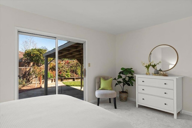 bedroom with light carpet and access to outside