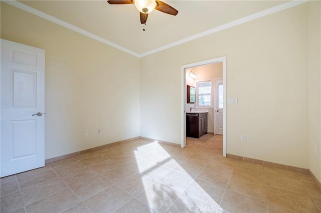 tiled spare room with crown molding and ceiling fan