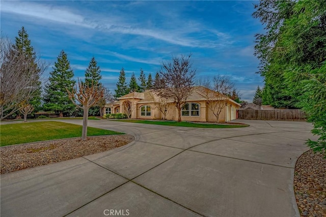 view of front facade with a garage and a front lawn