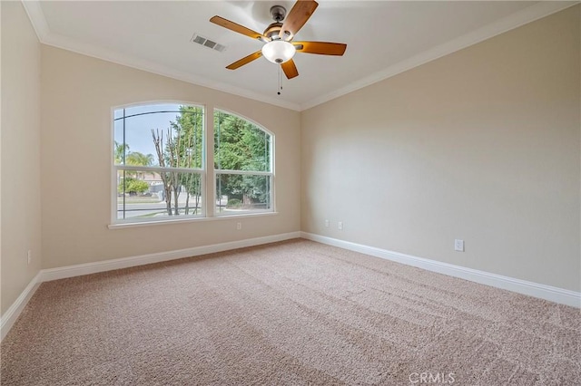 carpeted empty room with crown molding and ceiling fan