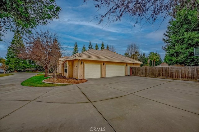 view of property exterior featuring a garage