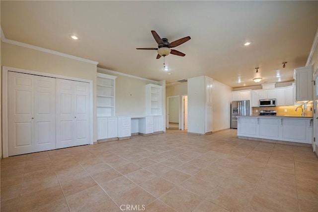 interior space featuring sink, light tile patterned floors, ornamental molding, and ceiling fan