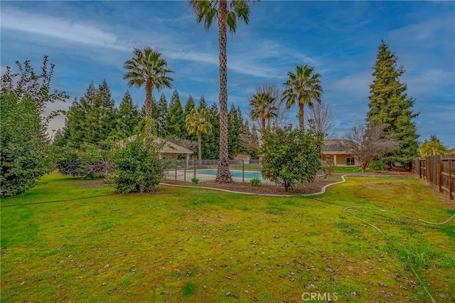 view of yard featuring a fenced in pool