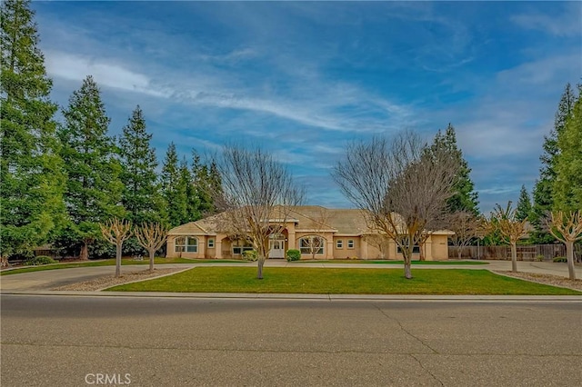 view of front of house with a front lawn