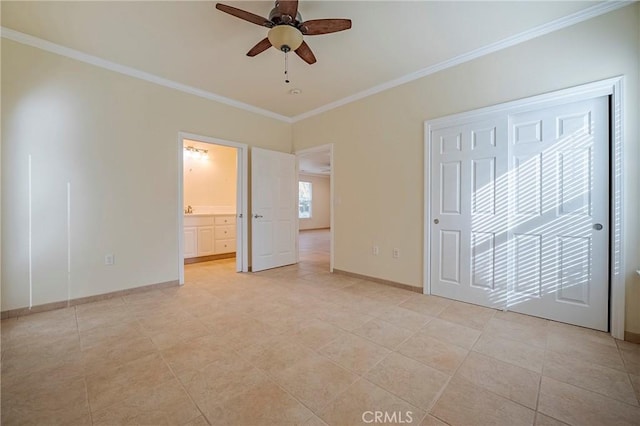 unfurnished bedroom featuring ceiling fan, ornamental molding, connected bathroom, and a closet