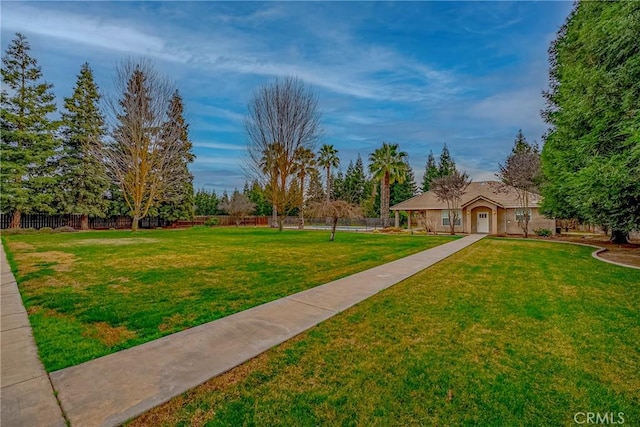 view of community featuring a yard