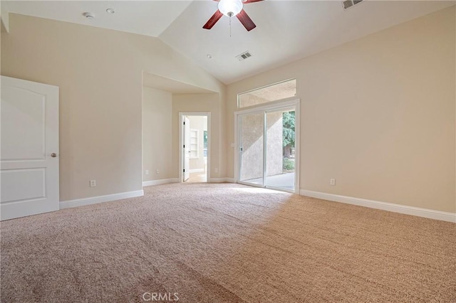 unfurnished room featuring lofted ceiling, carpet flooring, and ceiling fan