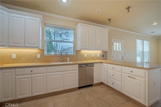 kitchen with white cabinetry, sink, stainless steel dishwasher, and kitchen peninsula