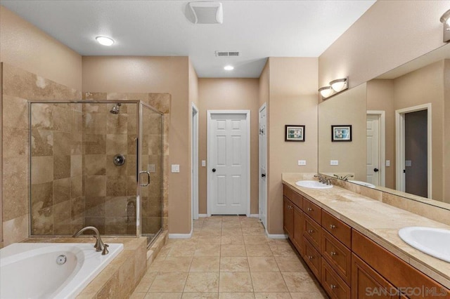 bathroom with vanity, plus walk in shower, and tile patterned flooring