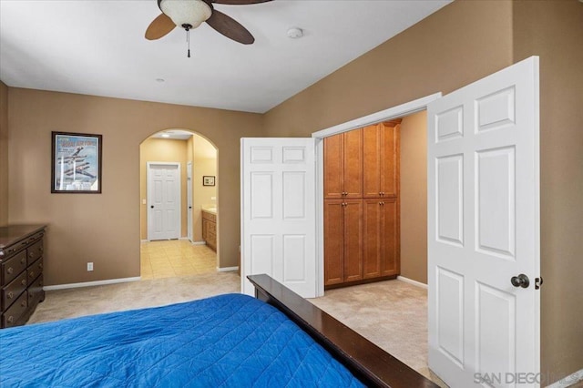 unfurnished bedroom with ceiling fan and light colored carpet