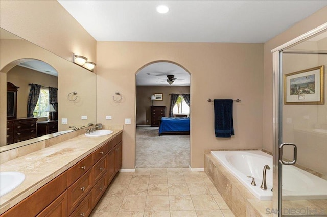 bathroom with independent shower and bath, vanity, tile patterned floors, and ceiling fan