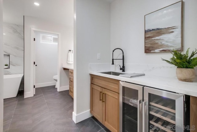 bathroom with vanity, a bathing tub, beverage cooler, and toilet