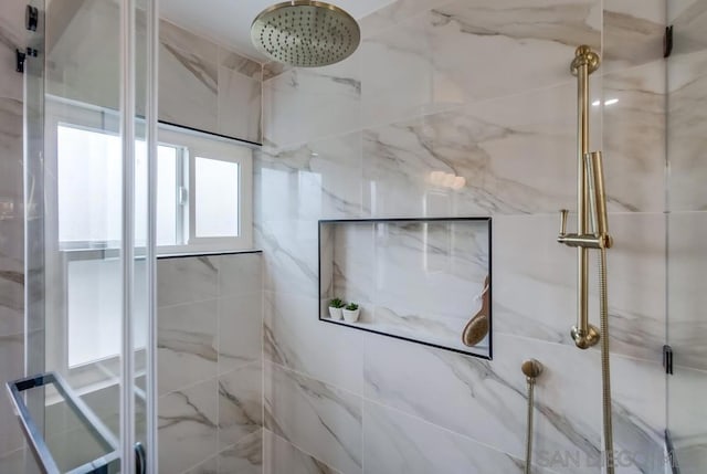 bathroom with a tile shower