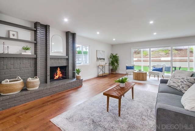 living room featuring a fireplace and hardwood / wood-style floors