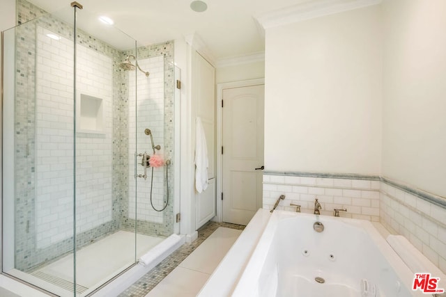 bathroom with crown molding and independent shower and bath