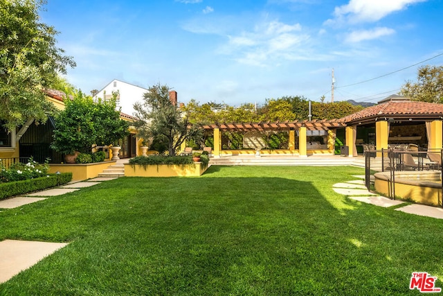 view of yard featuring a gazebo, a pergola, and a patio area