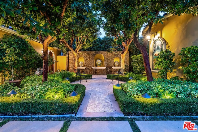 view of home's community with a patio area