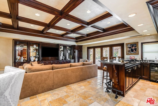 living room featuring beamed ceiling, coffered ceiling, and beverage cooler