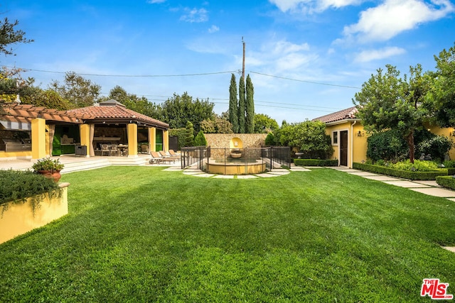 view of yard with a gazebo and a patio area