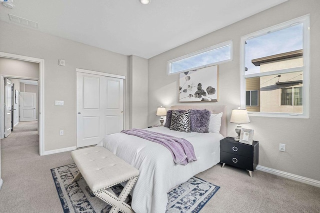 carpeted bedroom featuring a closet