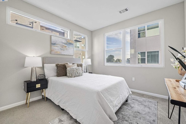 bedroom with light carpet