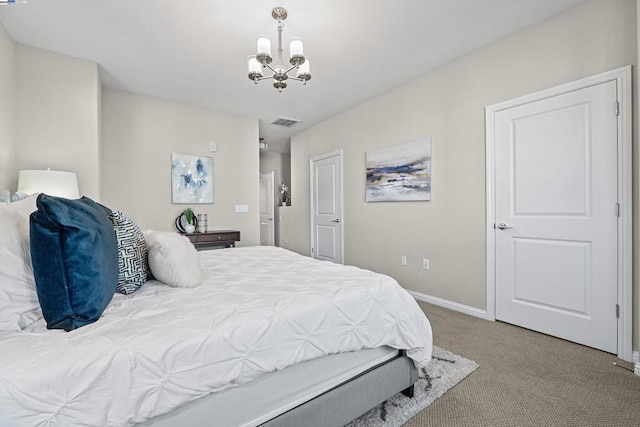 bedroom featuring light colored carpet and a chandelier