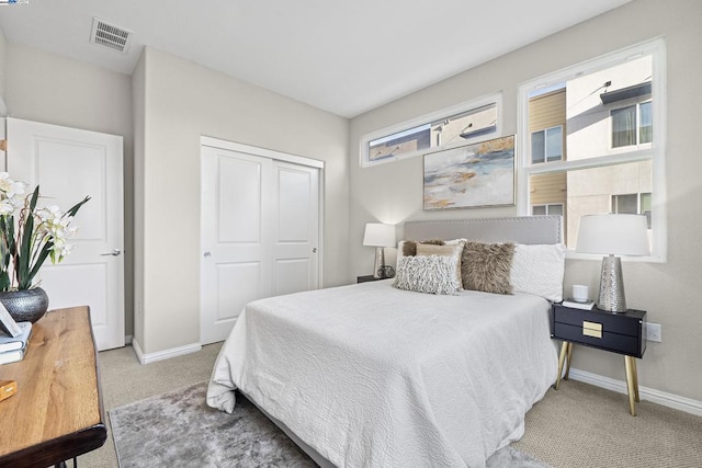 carpeted bedroom featuring a closet