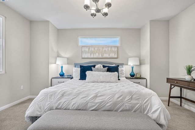 carpeted bedroom with a notable chandelier