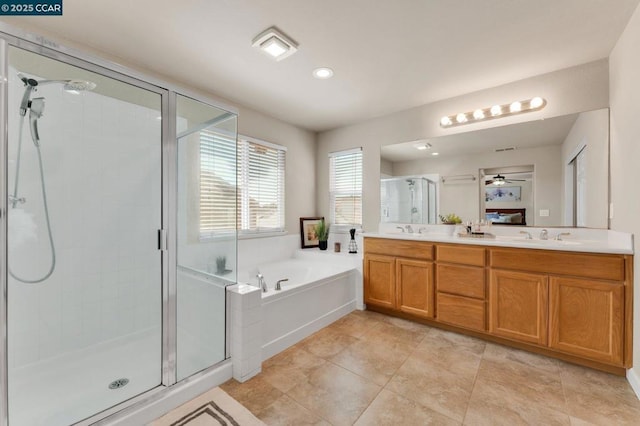 bathroom featuring plus walk in shower, tile patterned floors, vanity, and ceiling fan