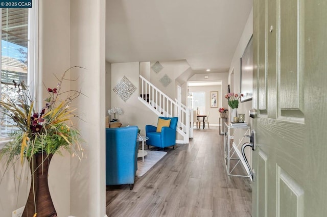 entryway with hardwood / wood-style flooring and plenty of natural light