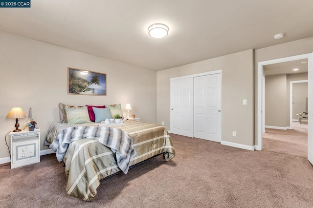 carpeted bedroom featuring a closet