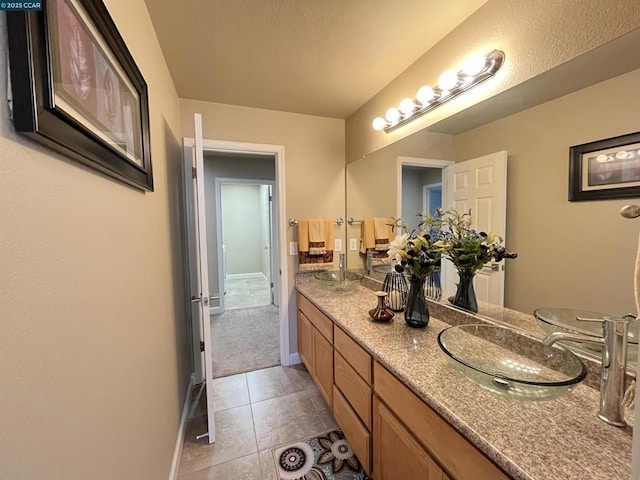 bathroom with vanity and tile patterned floors