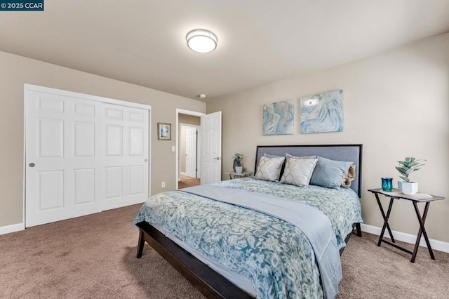 carpeted bedroom featuring a closet