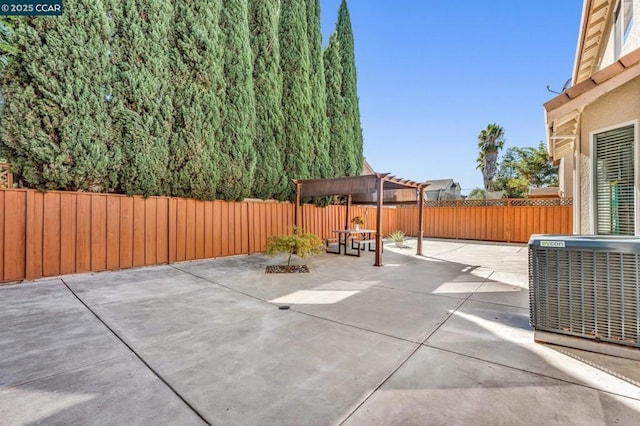 view of patio featuring central AC and a pergola