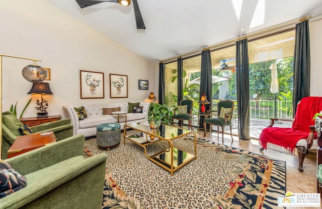 living room with tile patterned flooring, expansive windows, lofted ceiling, and ceiling fan