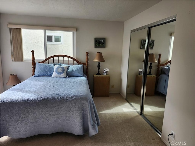 bedroom featuring carpet flooring and a closet