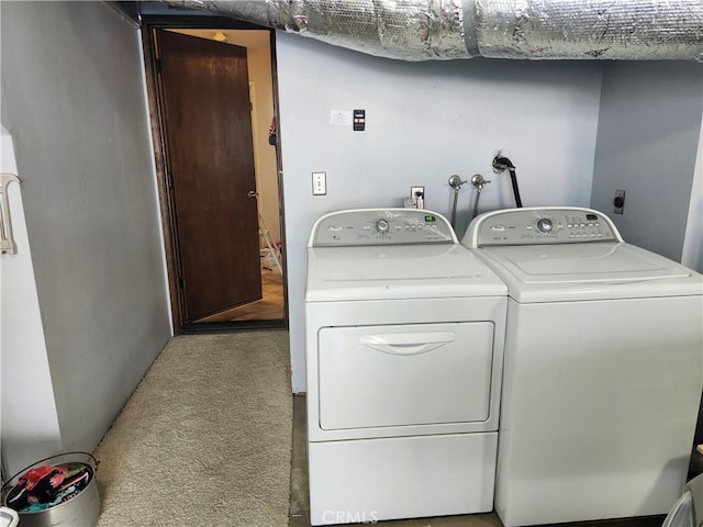 laundry area featuring washer and dryer and carpet flooring