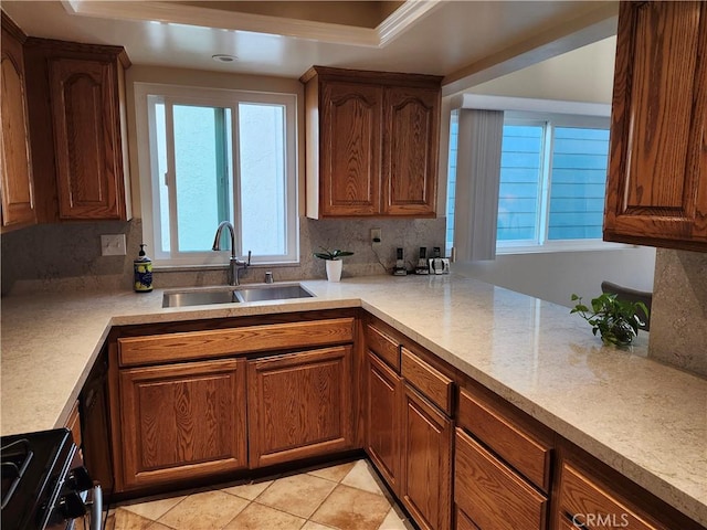 kitchen featuring light tile patterned flooring, sink, electric range oven, and backsplash