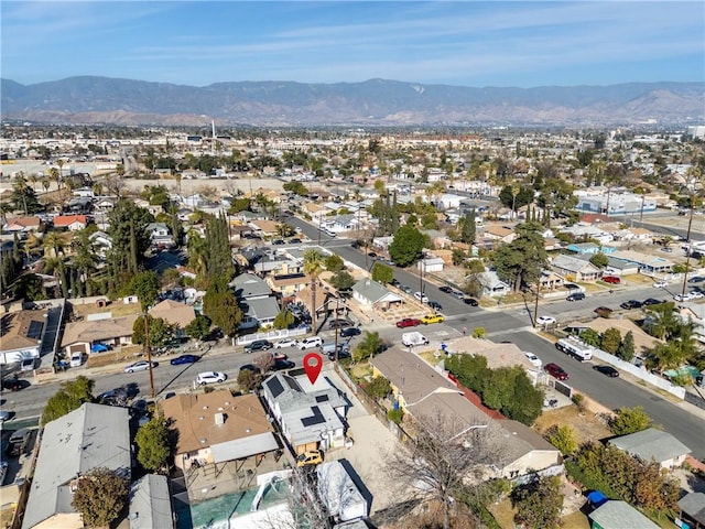 birds eye view of property featuring a mountain view