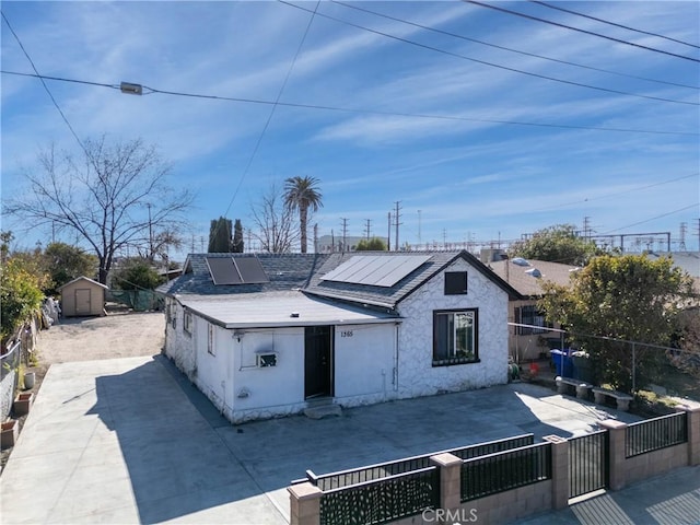 back of property with solar panels