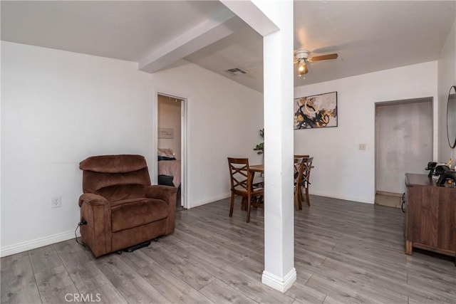 sitting room with ceiling fan and light hardwood / wood-style floors