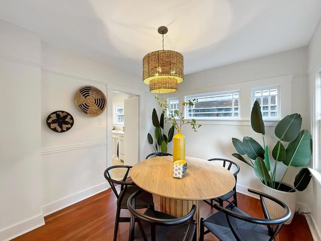 dining room with dark wood-type flooring