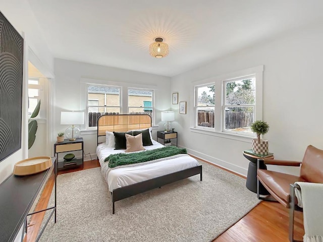 bedroom with hardwood / wood-style floors