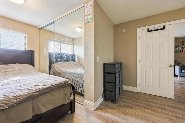 bedroom with hardwood / wood-style floors