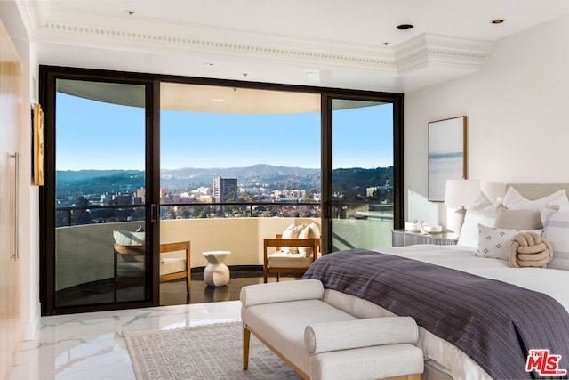 bedroom with multiple windows and a mountain view