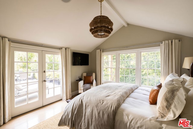 bedroom with french doors, lofted ceiling with beams, and access to outside