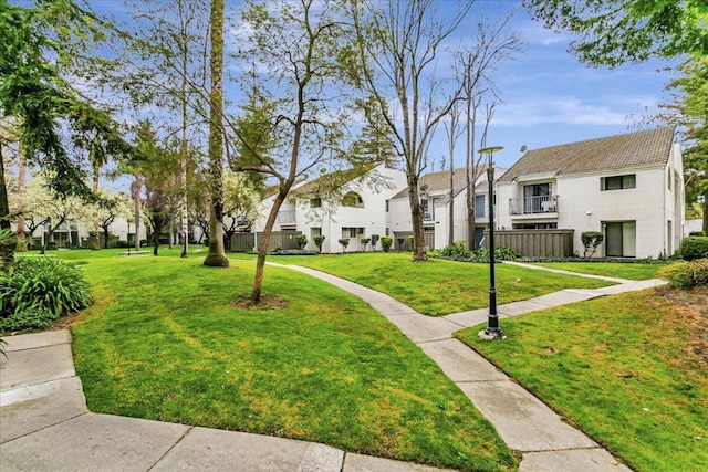 view of home's community featuring a yard