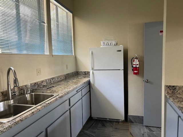 kitchen with white refrigerator and sink