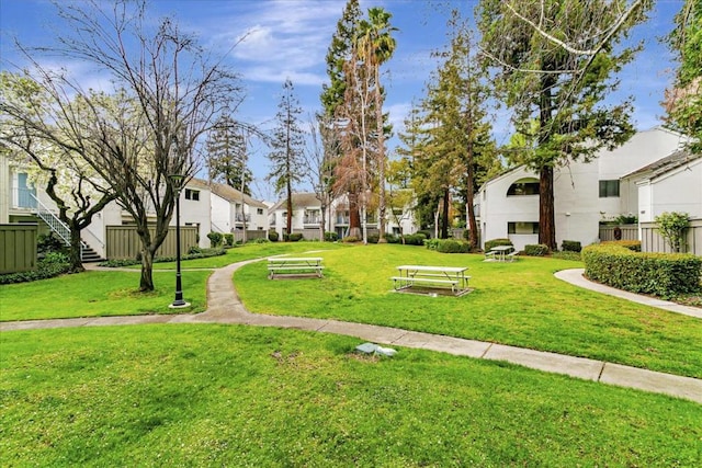 view of property's community with a yard